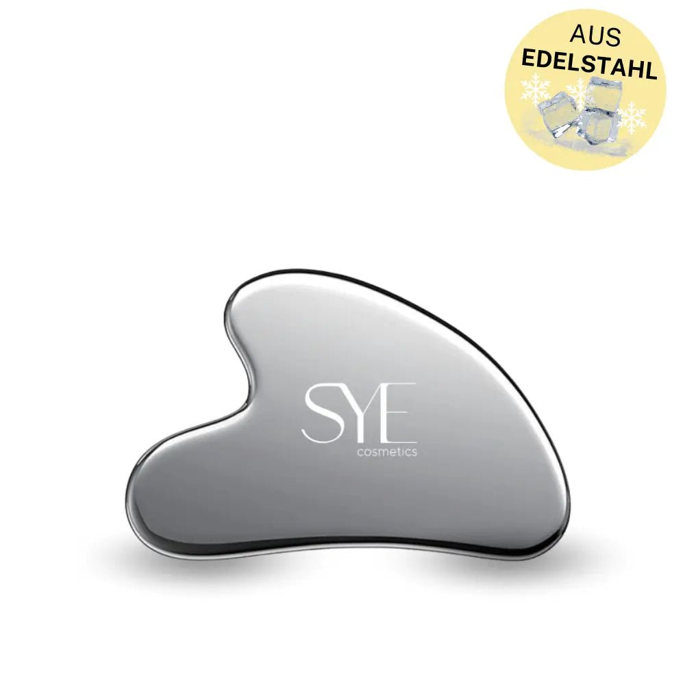 Edelstahl Gua Sha Stein isoliert auf neutralem Hintergrund, ideal für hautstraffende Massagen